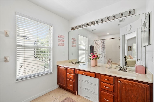 bathroom with plenty of natural light, tile patterned floors, double vanity, and curtained shower
