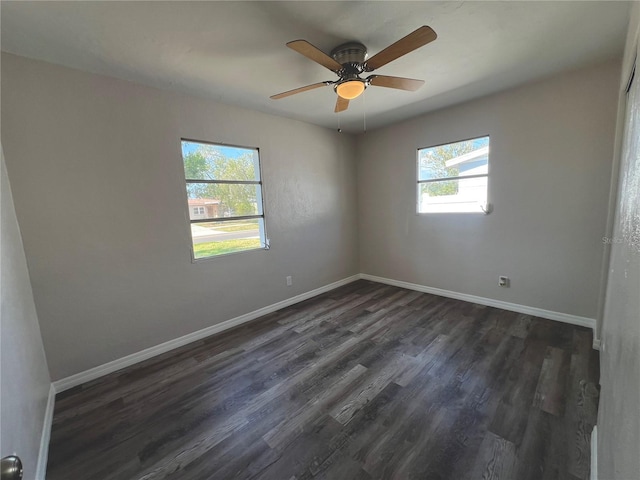 unfurnished room with a wealth of natural light and baseboards