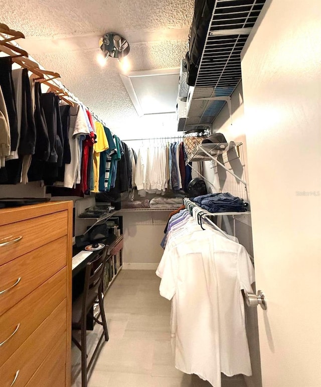 spacious closet featuring light floors