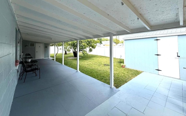 view of patio / terrace featuring fence