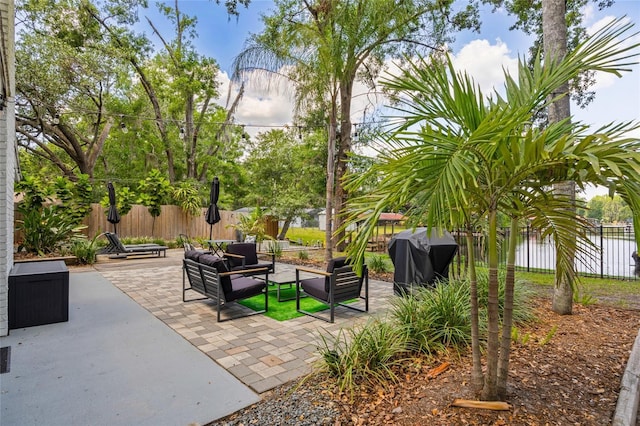 view of home's community with an outdoor living space, a patio, and a fenced backyard