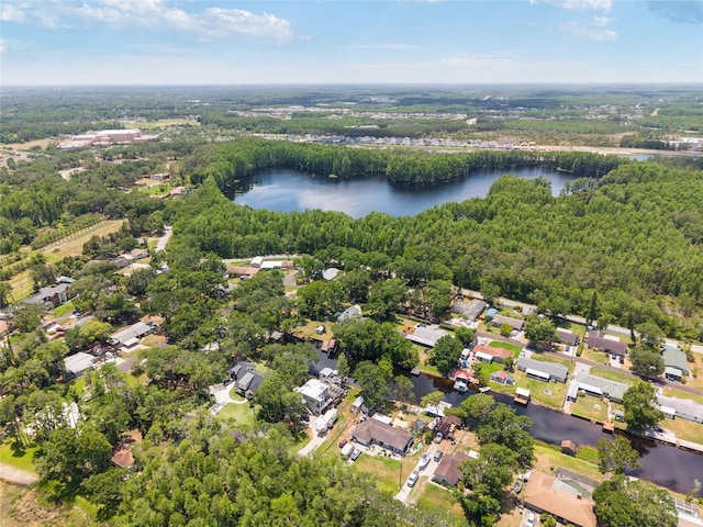 aerial view featuring a water view, a forest view, and a residential view