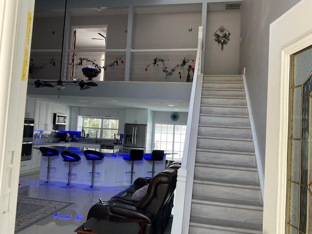 11727 Spanish Lake Dr, Tampa, FL 33635 - stairway with a high ceiling and visible vents