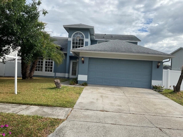 11727 Spanish Lake Dr, Tampa, FL 33635 - traditional-style house featuring driveway, a garage, fence, a front lawn, and stucco siding