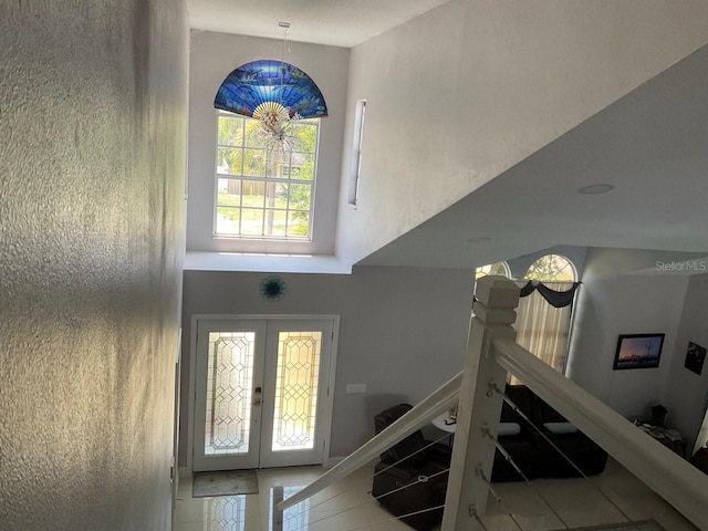 11727 Spanish Lake Dr, Tampa, FL 33635 - tiled entrance foyer with french doors and a towering ceiling