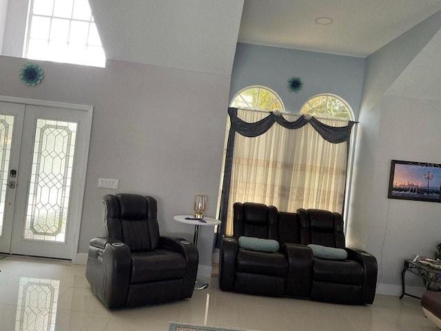 11727 Spanish Lake Dr, Tampa, FL 33635 - living room featuring baseboards, tile patterned floors, and french doors