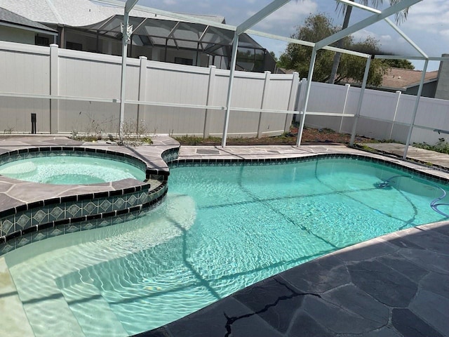 11727 Spanish Lake Dr, Tampa, FL 33635 - view of swimming pool with a fenced backyard, a lanai, and a pool with connected hot tub