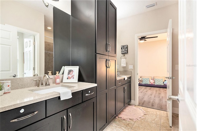 bathroom featuring ensuite bath, tile patterned floors, vanity, and visible vents