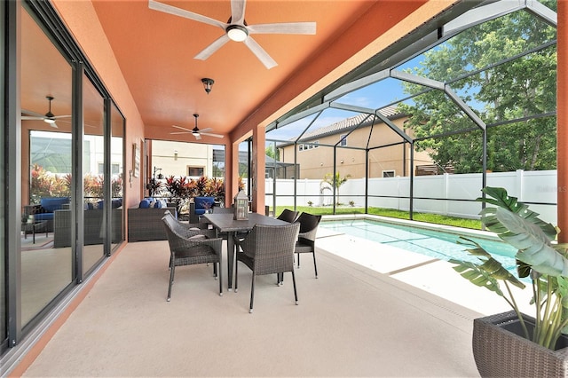 view of patio / terrace with a ceiling fan, a fenced in pool, and fence