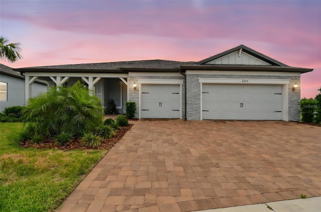 5670 Shorebird Br, Land O Lakes, FL 34638 - view of front facade with decorative driveway and a garage