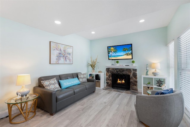 337 Rex Pl Unit G, Madeira Beach, FL 33708 - living area with a fireplace, recessed lighting, and light wood-style floors