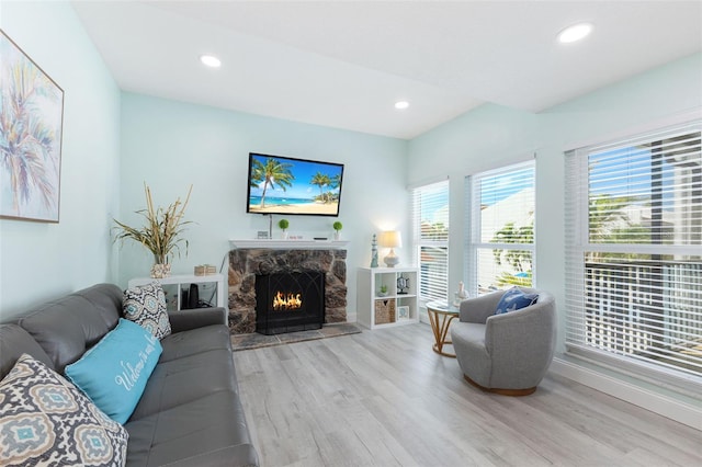 337 Rex Pl Unit G, Madeira Beach, FL 33708 - living area featuring wood finished floors, a fireplace, and recessed lighting