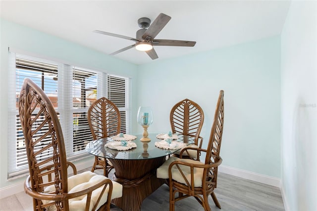 337 Rex Pl Unit G, Madeira Beach, FL 33708 - dining space featuring light wood finished floors, baseboards, and ceiling fan