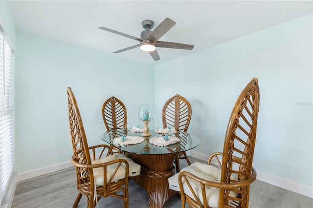 337 Rex Pl Unit G, Madeira Beach, FL 33708 - dining area with a ceiling fan, baseboards, and wood finished floors
