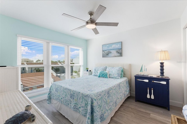 337 Rex Pl Unit G, Madeira Beach, FL 33708 - bedroom featuring light wood finished floors, baseboards, and a ceiling fan