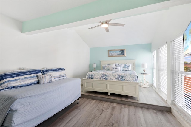 337 Rex Pl Unit G, Madeira Beach, FL 33708 - bedroom featuring lofted ceiling, multiple windows, a ceiling fan, and wood finished floors