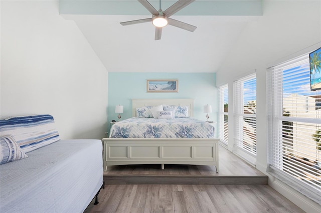 337 Rex Pl Unit G, Madeira Beach, FL 33708 - bedroom featuring wood finished floors, vaulted ceiling, access to outside, and a ceiling fan
