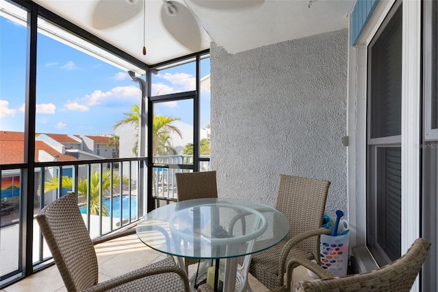 337 Rex Pl Unit G, Madeira Beach, FL 33708 - sunroom / solarium with a wealth of natural light and outdoor dining space