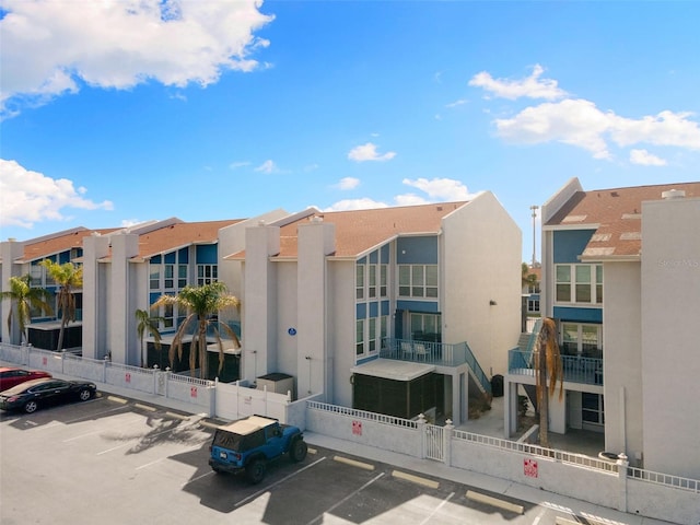 337 Rex Pl Unit G, Madeira Beach, FL 33708 - view of property featuring uncovered parking