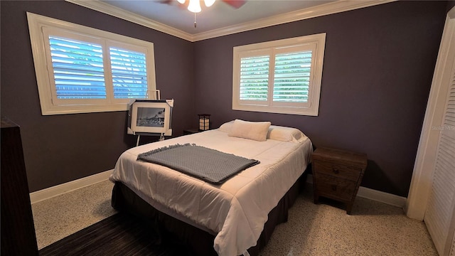 bedroom with baseboards, multiple windows, ornamental molding, and a ceiling fan