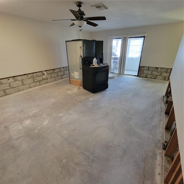 1234 11th Cir SE, Largo, FL 33771 - living room with concrete floors, ceiling fan, and concrete block wall