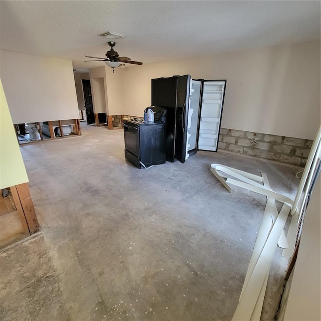 1234 11th Cir SE, Largo, FL 33771 - living area with unfinished concrete flooring and a ceiling fan