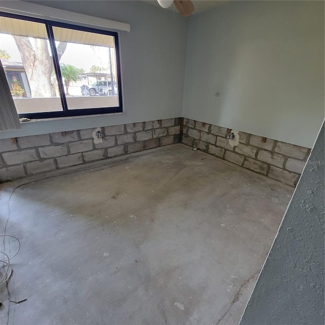 1234 11th Cir SE, Largo, FL 33771 - spare room featuring unfinished concrete flooring
