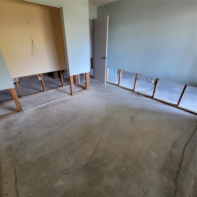 1234 11th Cir SE, Largo, FL 33771 - unfurnished bedroom with concrete flooring