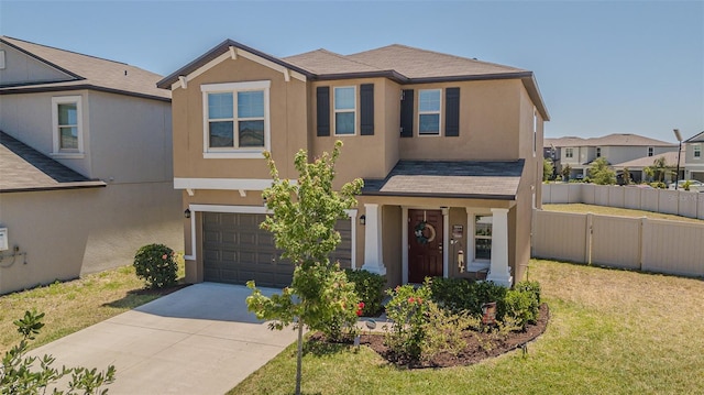 view of front of property with fence, a garage, stucco siding, and driveway