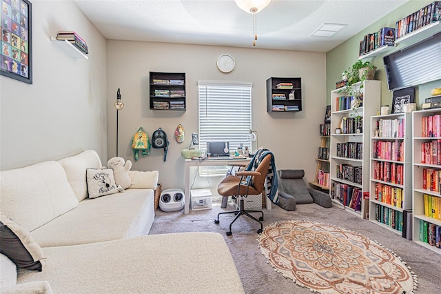 office area with ceiling fan and carpet