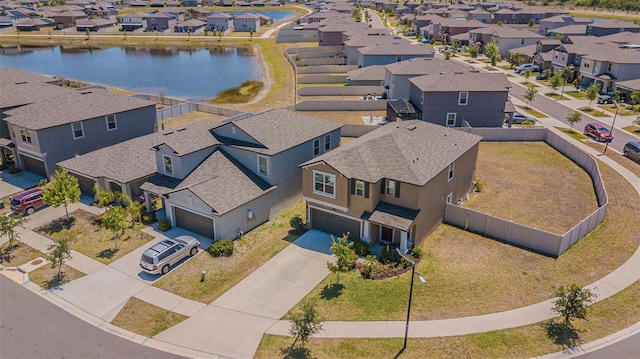 aerial view featuring a water view and a residential view
