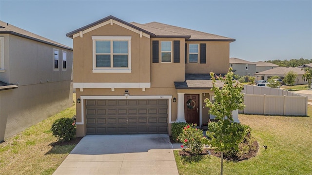view of front facade featuring fence, a garage, stucco siding, and driveway