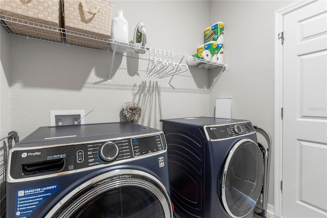 laundry room with washer and clothes dryer