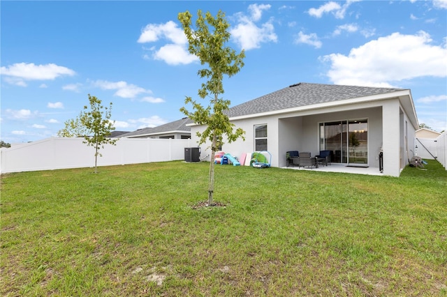 back of property featuring cooling unit, stucco siding, a patio, and a shingled roof
