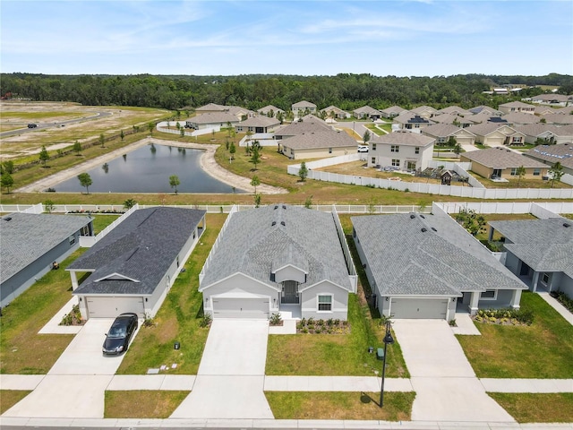 aerial perspective of suburban area with a large body of water