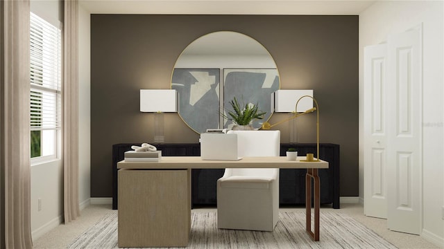 office space featuring baseboards and light carpet