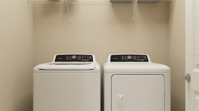 laundry room with laundry area and washer and clothes dryer