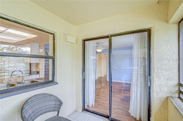 property entrance featuring stucco siding