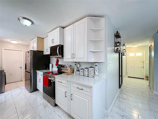kitchen with marble finish floor, white cabinetry, open shelves, light countertops, and appliances with stainless steel finishes