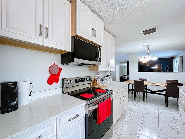 kitchen featuring a notable chandelier, marble finish floor, visible vents, stainless steel range with electric stovetop, and white cabinets