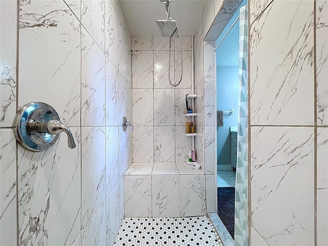 bathroom with tiled shower
