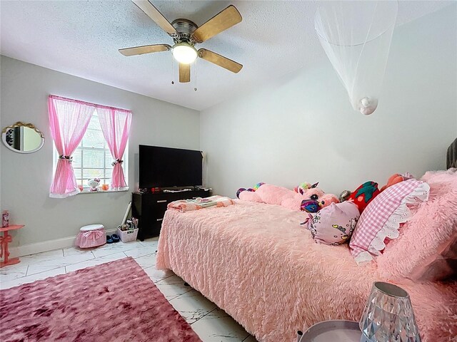 bedroom with baseboards, ceiling fan, and a textured ceiling