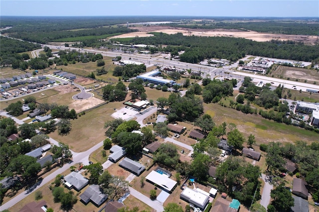 drone / aerial view featuring a view of trees