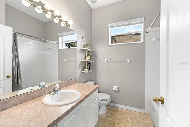 2808 Abbey Grove Dr, Valrico, FL 33594 - full bath with healthy amount of natural light, vanity, and shower / bath combination with curtain