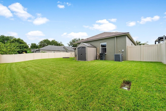 2808 Abbey Grove Dr, Valrico, FL 33594 - rear view of house with a shed, a fenced backyard, and stucco siding