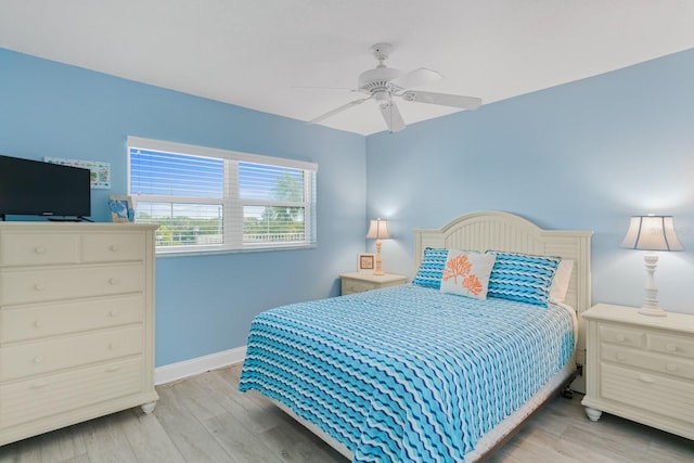 18650 Gulf Blvd Unit 203, Indian Shores, FL 33785 - bedroom featuring wood finished floors, baseboards, and a ceiling fan