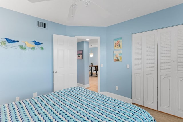 18650 Gulf Blvd Unit 203, Indian Shores, FL 33785 - bedroom with light wood-style floors, baseboards, a closet, and ceiling fan