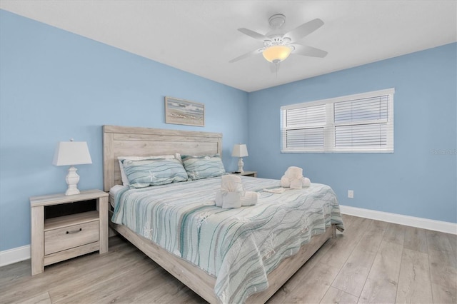 18650 Gulf Blvd Unit 203, Indian Shores, FL 33785 - bedroom with wood finished floors and a ceiling fan