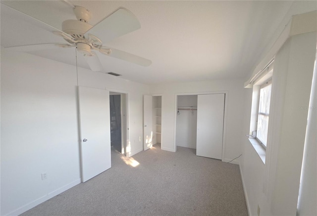 614 Guild Dr Unit 15, Venice, FL 34285 - unfurnished bedroom featuring a ceiling fan, a closet, visible vents, baseboards, and light carpet