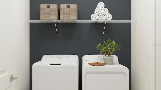 clothes washing area featuring laundry area and separate washer and dryer